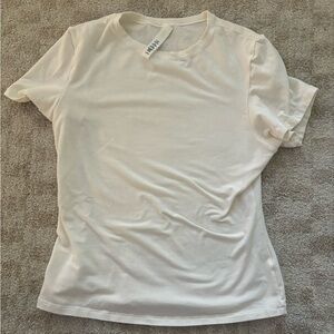 Skims off-white shirt, worn once. Tag slightly damaged.